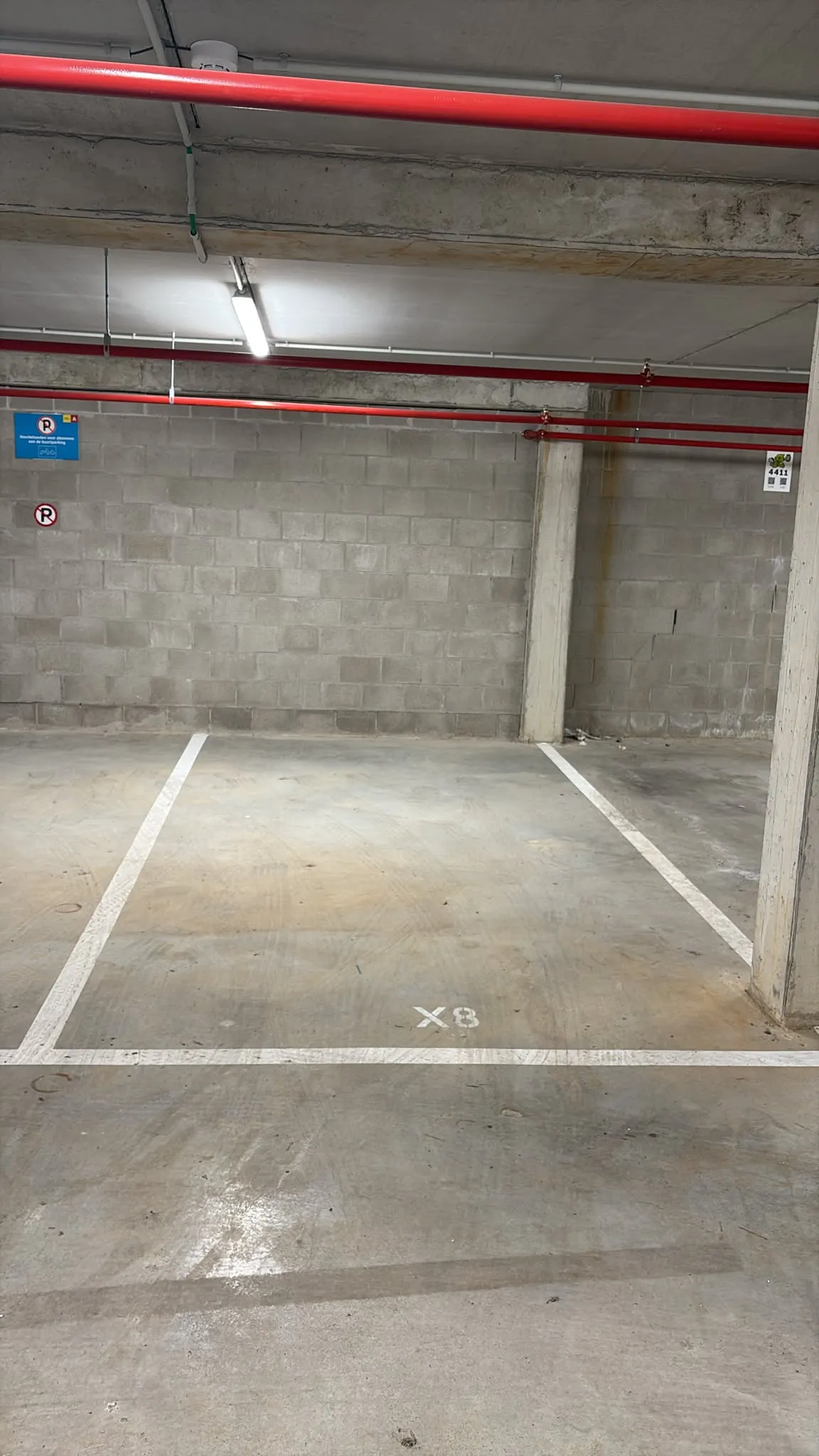 Covered parking area — LED lighting and CCTV coverage